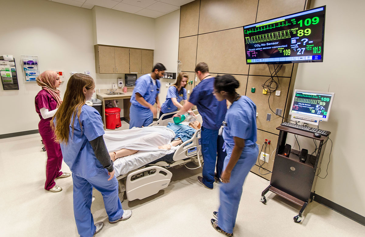 Medical students practice hand-on skills in a simulation lab